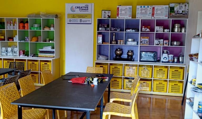 Creative Corner with colourful shelves of kitchen and craft equipment