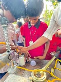Student demonstrating a working model