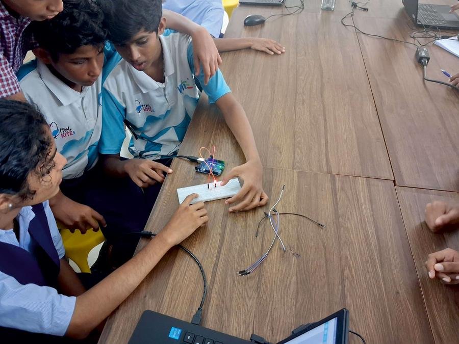 Students wiring a breadboard